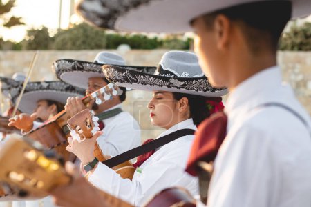 Photo for San Lucas Los Cabos, Mexico - 2023 Mexican Mariachi is a traditional musical ensemble generally made up of a minimum number of three members; generally using guitar, guitar, violin and trumpets - Royalty Free Image