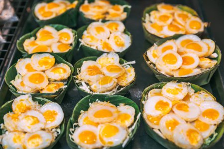 Photo for Thai street food concept, Fried quail egg in banana leaf tray at traditional shopping street market in Bangkok Thailand - Royalty Free Image