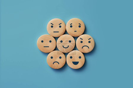 Photo for A variety of human emotions: joy, serenity, anger, sadness, delight, surprise on wooden circles - Royalty Free Image