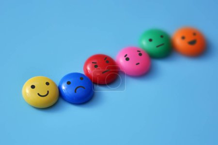 A variety of human emotions: joy, serenity, anger, sadness on colored balls-stock-photo