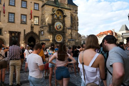 Photo for Crowd of tourist in the mediaeval tower clock which is located at the southern side of the Old Town Hall Tower in Prague, Czechia on July 26, 2022. - Royalty Free Image