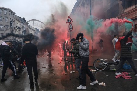 Photo for Protestors clashed with riot police after the Qatar 2022 World Cup football match between Belgium and Morocco, in Brussels, Belgium on November 27, 2022. - Royalty Free Image
