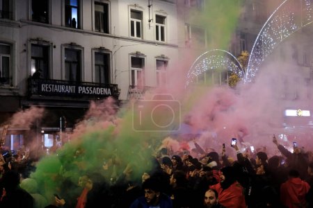 Photo for Supporters of Morocco national team celebrate their victory after the Qatar 2022 World Cup Group F football match between Morocco and Canada, in Brussels, Belgium on December 1, 2022. - Royalty Free Image