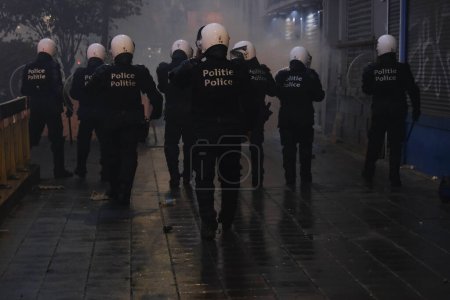 Photo for Fans of Morocco national team clashed with riot police after the Qatar 2022 World Cup football match between Belgium and Morocco, in Brussels, Belgium on November 27, 2022. - Royalty Free Image