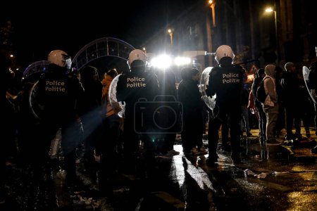 Photo for Protestors clashed with riot police after the Qatar 2022 World Cup football match between Spain and Morocco, in Brussels, Belgium on December 6, 2022. - Royalty Free Image