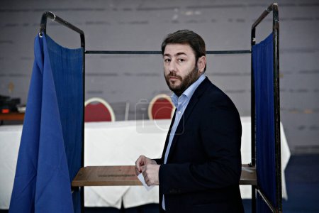 Photo for MEP Androulakis Nikos, candidate for the leadership of Movement for Change casts his ballot during election in Rhodes, Greece on Nov. 12, 2017 - Royalty Free Image