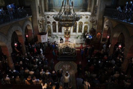 Photo for Orthodox Christian worshipers take part in the Epitaph Litany during Holy Friday afternoon  in the Cathedral of Saint Stephen in Paris, France on April 23, 2022. - Royalty Free Image