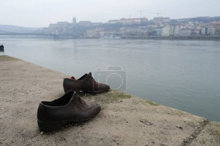 Photo for The memorial of shoes remembering the Holocaust victims on the bank of the River Danube in downtown Budapest, Hungary on December 22, 2022. - Royalty Free Image