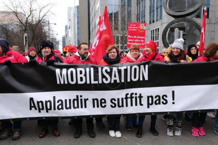 Photo for Workers take part in a protest action of the trade unions of the non-profit sector as they demand the government invest more in their sector,in Brussels, Belgium in January 31, 2023. - Royalty Free Image