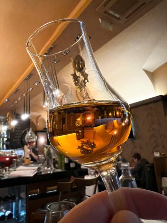 Téléchargez les photos : A glass of palinka which is  a Hungarian folk beverage of the countryside in Budapest, Hungary on December 20, 2022. - en image libre de droit