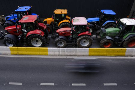 Photo for Farmers with their tractors from Belgium's northern region of Flanders take part in a protest against a new regional government plan to limit nitrogen emissions, in Brussels, Belgium on March 3, 2023. - Royalty Free Image