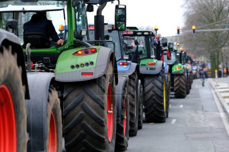 Photo for Farmers with their tractors from Belgium's northern region of Flanders take part in a protest against a new regional government plan to limit nitrogen emissions, in Brussels, Belgium on March 3, 2023. - Royalty Free Image