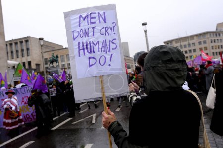 Photo for Activists hold placards and chant slogans during a rally to mark the International Women's Day in Brussels, Belgium on March 8, 2023. - Royalty Free Image
