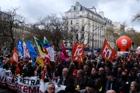 Photo for People gather in central streets to take part in a national strike against government plans to revamp the pension system in central Paris, France on April 06, 2023. - Royalty Free Image