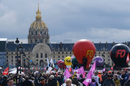 Photo for People gather in central streets to take part in a national strike against government plans to revamp the pension system in central Paris, France on April 06, 2023. - Royalty Free Image