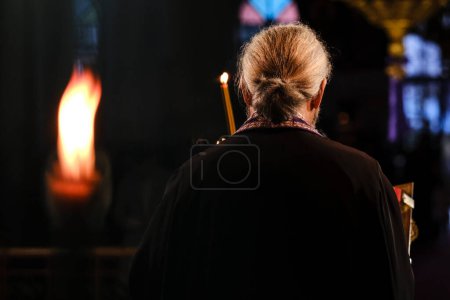 Photo for A priest attends in a special ceremony of Jesus Christ's crucifixion in Orthodox Church in Platy, Greece on April 13, 2023. - Royalty Free Image