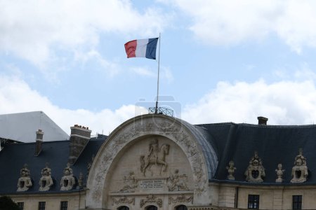 Photo for A French flag waves in building of central Paris, France on April 06, 2023. - Royalty Free Image