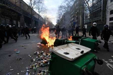 Photo for Demonstrators set up a burning barricade during clashes with riot police during a nationwide demonstration in Paris, France on April 6, 2023. - Royalty Free Image