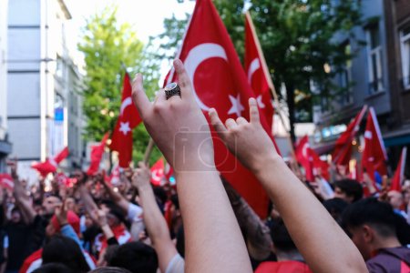 Photo for Supporters of Turkish President Erdogan celebrate after the results of the runoff election in Brussels, Belgium on May 28, 2023. - Royalty Free Image