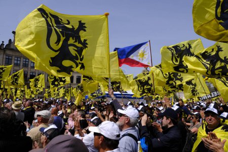 Photo for Supporters of of Flemish far-right party Vlaams Belang wave flags of Flandre during a protest in Brussels, Belgium on May 29, 2023. - Royalty Free Image