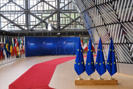 Photo for Brussels, Belgium. 29th June 2023. EU flags in the lobby of the European Council building during the EU Summit. - Royalty Free Image