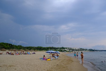 Photo for People in the beach during a stormy day in Kyllini, Greece on August 24, 2023. - Royalty Free Image
