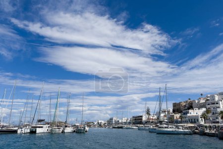 Photo for Leisure and fish boats docked i in greek island of Naxos, Greece on May 4, 2024. - Royalty Free Image