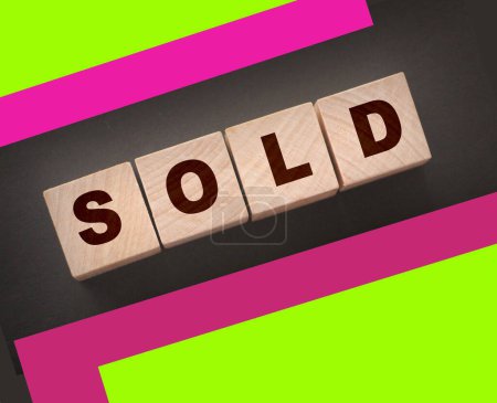 Photo for Sold Word Written In Wooden Cubes on black background. Real estate business concept - Royalty Free Image