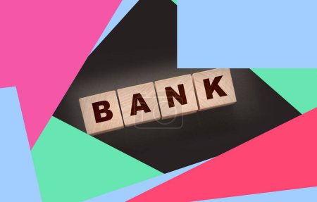 Photo for Bank word concept written on wooden cubes on black table. Banking saving financial investment concept. - Royalty Free Image