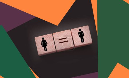 Foto de Conceptos de igualdad de género. cubos de madera con símbolo femenino y masculino y signo igual. Igualdad de retribución concepto de cuarentena social. - Imagen libre de derechos