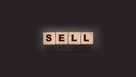 Photo for Wooden cubes with word sell on the dark background. Shopping concept. - Royalty Free Image
