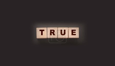 Photo for Concept word true on wooden cubes on black background. - Royalty Free Image