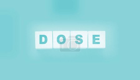 Photo for Wooden blocks with the word Dose. Medical concept. - Royalty Free Image