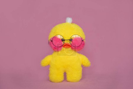 Foto de Duck lalafanfan yellow on a pink background. Soft toy duck. Mockup, copy space. - Imagen libre de derechos