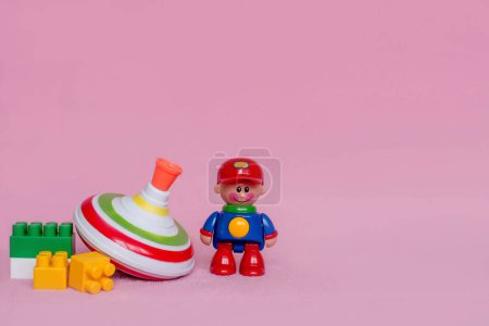 Foto de Toys on a pink background with empty space for text - Imagen libre de derechos