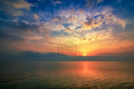 Photo for Dramatic sunrise clouds view in Alkhobar sea side Saudi Arabia. City : Khobar, Country : Saudi Arabia. - Royalty Free Image