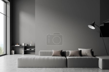 Photo for Dark living room interior with sofa on grey concrete floor. Shelf with decoration on background, panoramic window on countryside. Mockup copy space wall. 3D rendering - Royalty Free Image