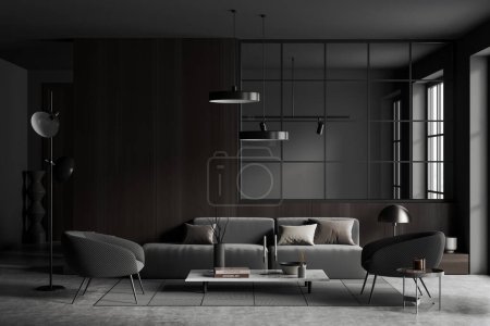 Photo for Dark living room interior with sofa and armchairs, carpet on grey concrete floor. Glass wall partition and panoramic window. Copy space wooden wall. 3D rendering - Royalty Free Image