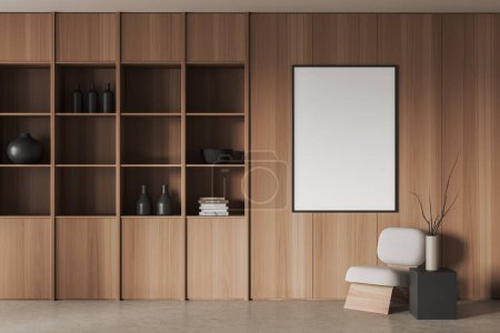 Foto de Luz interior de la sala de estar con sillón, estante de madera con decoración de arte minimalista y piso de hormigón beige. Mock up cartel de lienzo en blanco. Renderizado 3D - Imagen libre de derechos