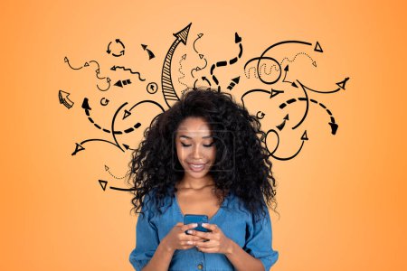 Foto de Black young woman browse in smartphone, black arrows and doodle lines on orange background. Concept of choice and online education - Imagen libre de derechos