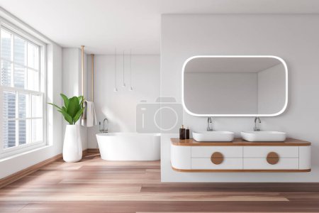 Téléchargez les photos : Intérieur salle de bain blanche avec baignoire et double lavabo avec miroir, parquet. Accessoires de bain, porte-serviettes et plante, fenêtre panoramique sur les gratte-ciel. rendu 3D - en image libre de droit