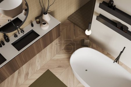Téléchargez les photos : Vue de dessus de l'intérieur élégant de la salle de bain avec lavabo et baignoire. Commode et étagère en bois avec accessoires de bain et décoration, tapis sur plancher de bois franc. rendu 3D - en image libre de droit