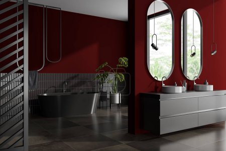 Téléchargez les photos : Intérieur de salle de bain rouge et sombre avec baignoire et double lavabo, vue latérale sur le sol en béton carrelé brun. Zone de baignade avec porte-serviettes et fenêtre. rendu 3D - en image libre de droit