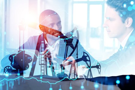Foto de Two businessmen working together silhouette. Double exposure with oil mining industry and forex diagrams with candlesticks. Concept of mining and analysis - Imagen libre de derechos