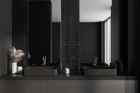 Téléchargez les photos : Dark bathroom interior with double sink and dresser. Two mirrors with bathing accessories and panoramic window on skyscrapers. 3D rendering - en image libre de droit