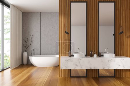 Foto de Stylish bathroom interior with bathtub in the corner, double sink with accessories and hardwood floor. Panoramic window on tropics. 3D rendering - Imagen libre de derechos