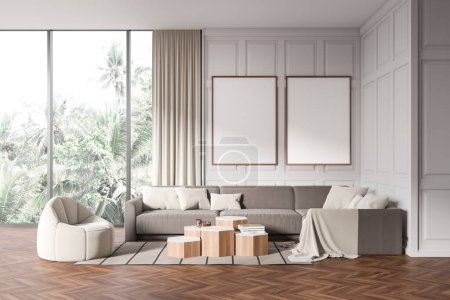 Téléchargez les photos : White living room interior armchair and sofa with coffee table, carpet on hardwood floor. Panoramic window on tropics. Two mock up canvas posters. 3D rendering - en image libre de droit