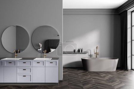 Photo for Grey bathroom interior with double sink and dresser, bathtub with accessories near window. Bathing area and partition, dark hardwood floor. Mockup copy space wall. 3D rendering - Royalty Free Image