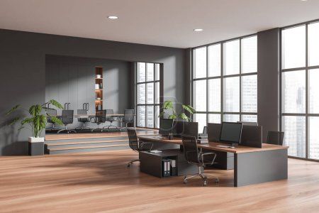 Photo for Dark office room interior with conference zone on podium, coworking corner with armchairs and pc computers. Panoramic window on skyscrapers. 3D rendering - Royalty Free Image
