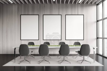 Téléchargez les photos : Stylish meeting room interior with armchairs and table, carpet on dark concrete floor. Modern conference room with panoramic window. Three mockup posters. 3D rendering - en image libre de droit